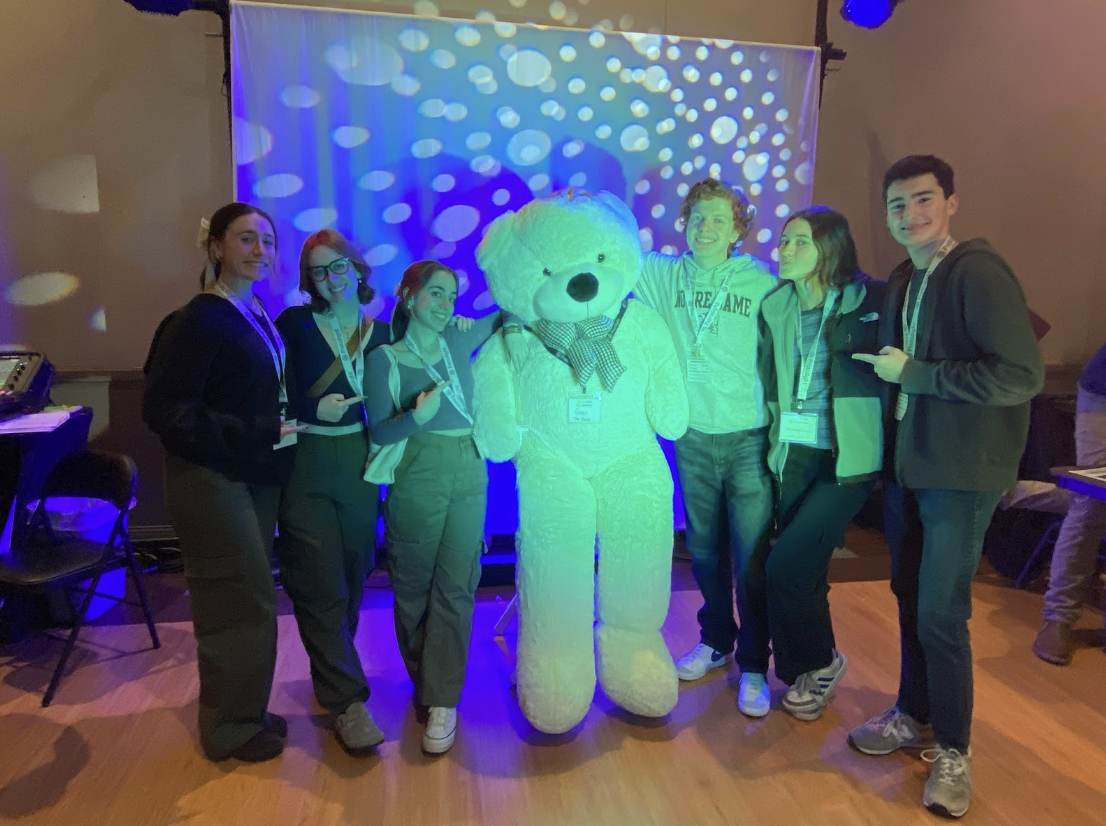 (From left to right) Millie Foley, Katie-May Newman, Kallista Schneiderman, Gobo the Bear, Declan Boyle, Nora Sharman, and Evan Spezzano at the Bone Student Center on the first day of Theater Fest.
